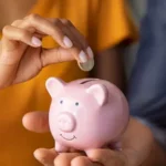 couplesavingmoneyinjar